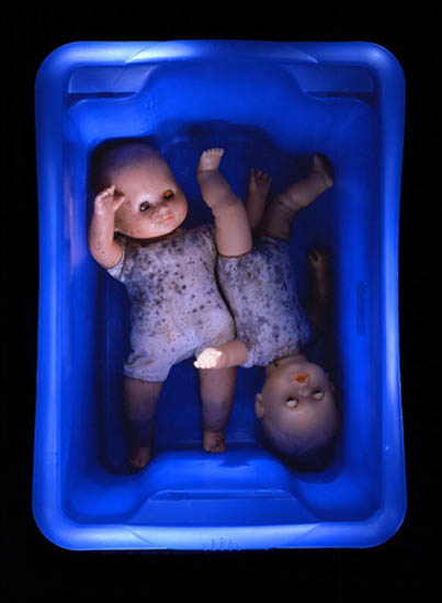 author: Jeremy Webb
title: dolls in blue tub